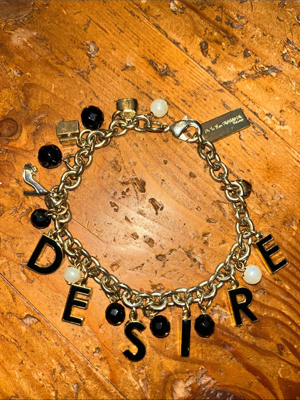 DOLCE & GABBANA Gold Charm Bracelet with Black Letter & Bead Accents - 'DESIRE'